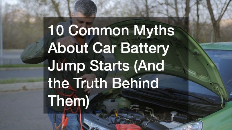 man preparing to jump-start a car